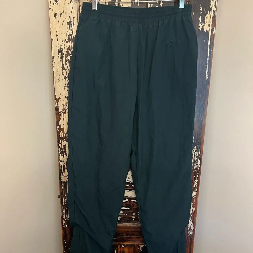 Men’s Vintage Reebok Nylon ankle zip track pants.